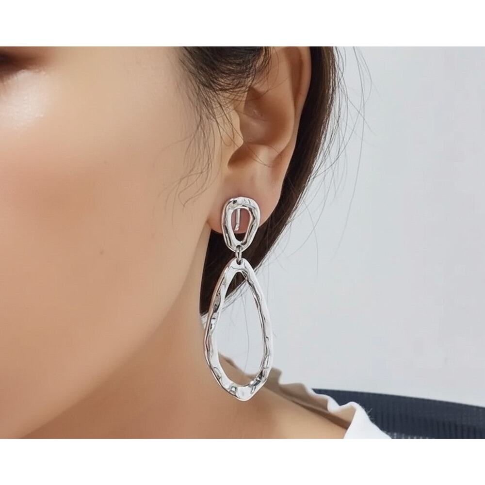 Clip on 2 1/2" silver hammered odd shaped dangle earrings